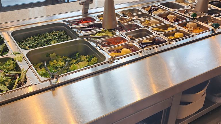 People cheering whine glasses at a table