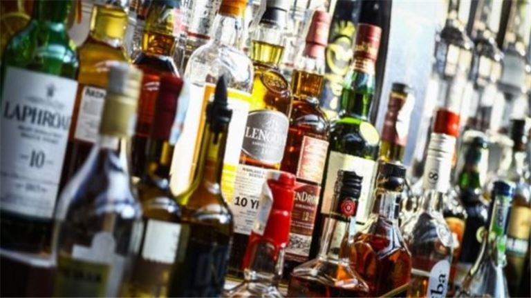 People cheering whine glasses at a table