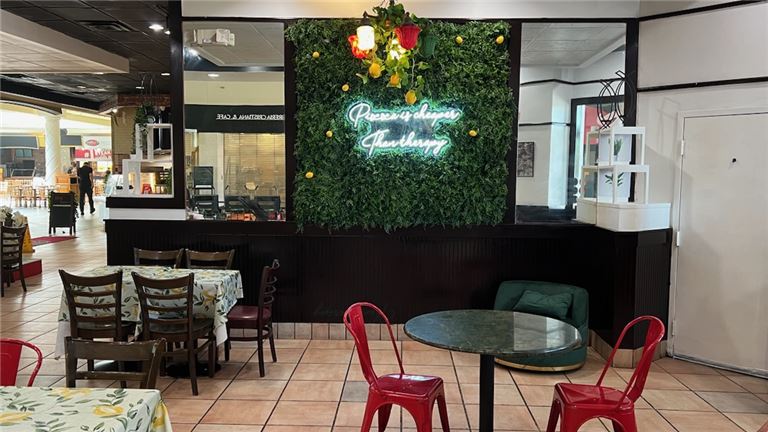 3 People cheering whine glasses at a table