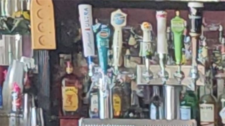 3 People cheering whine glasses at a table