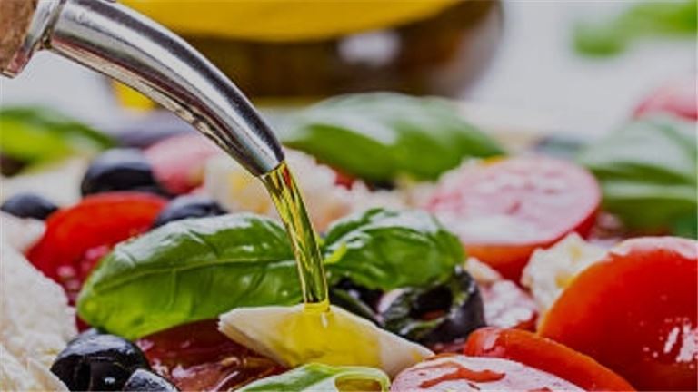 People cheering whine glasses at a table