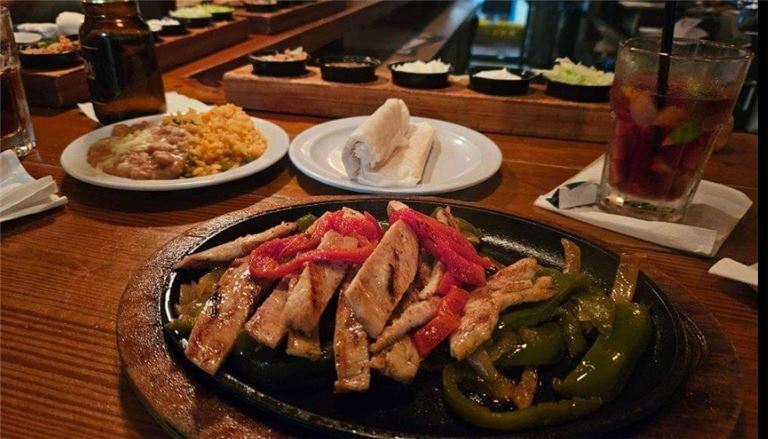 People cheering whine glasses at a table