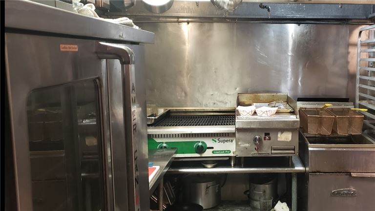 People cheering whine glasses at a table